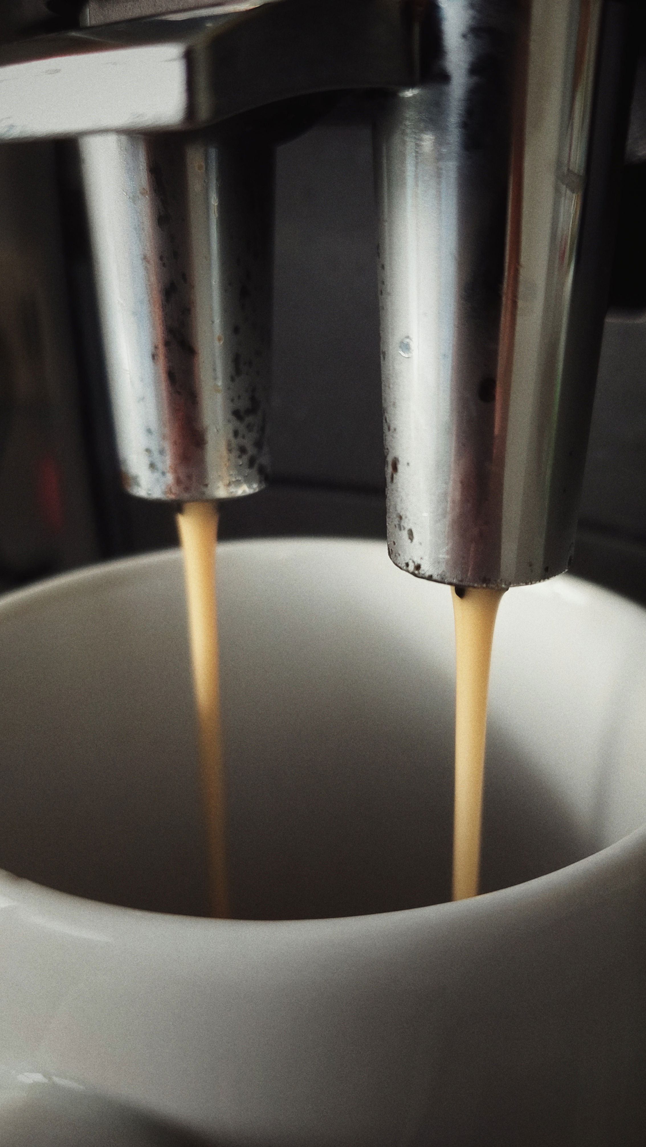 Coffee flowing into a mug.
