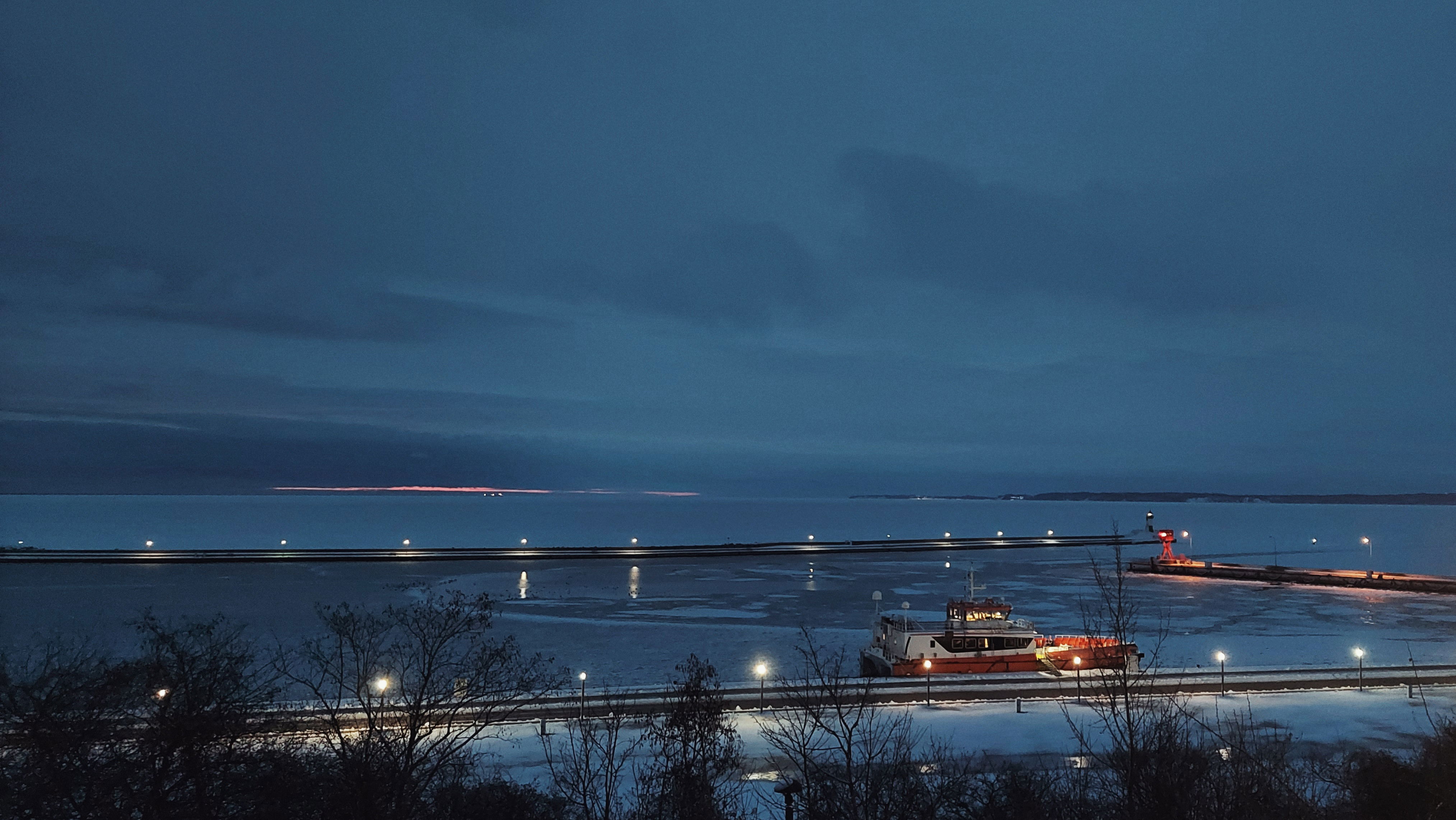 A quiet part of a city harbour in very early morning.
