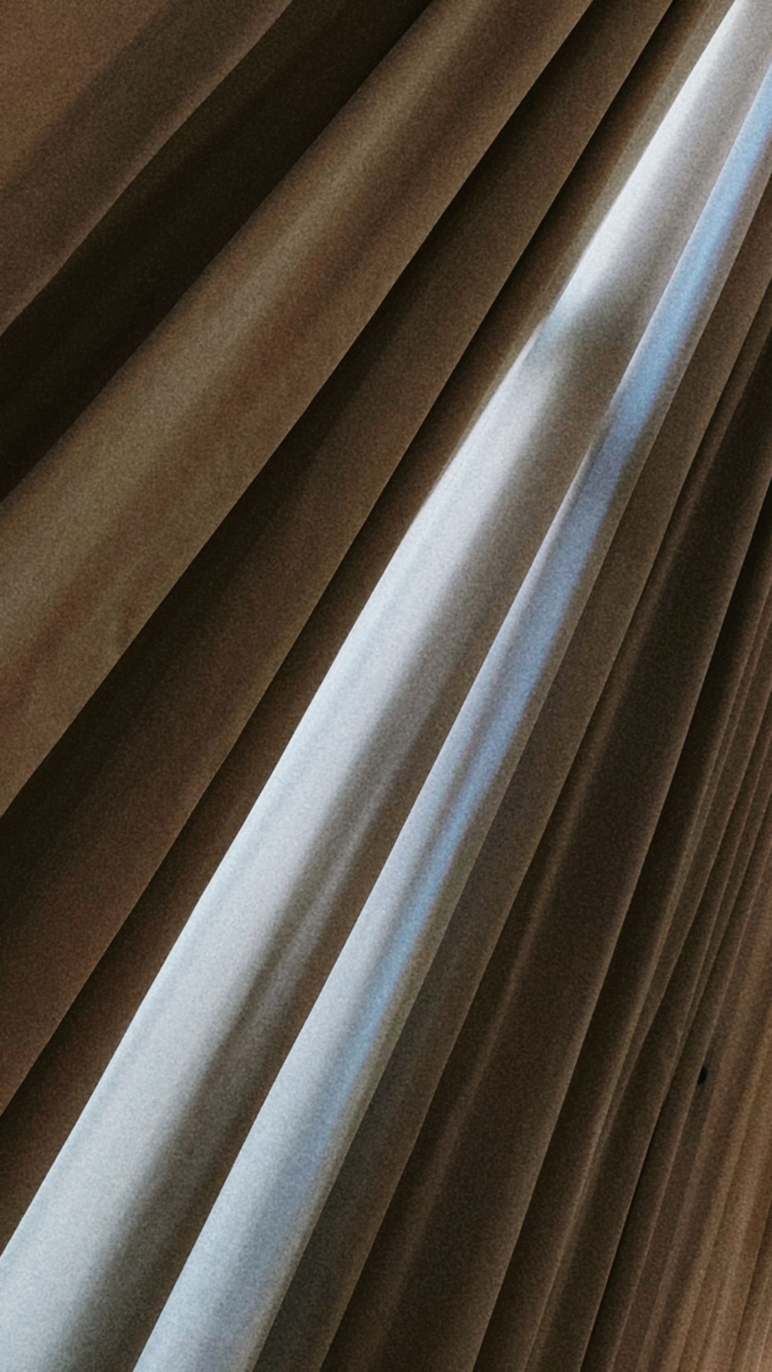 Sunlight through huge curtains.