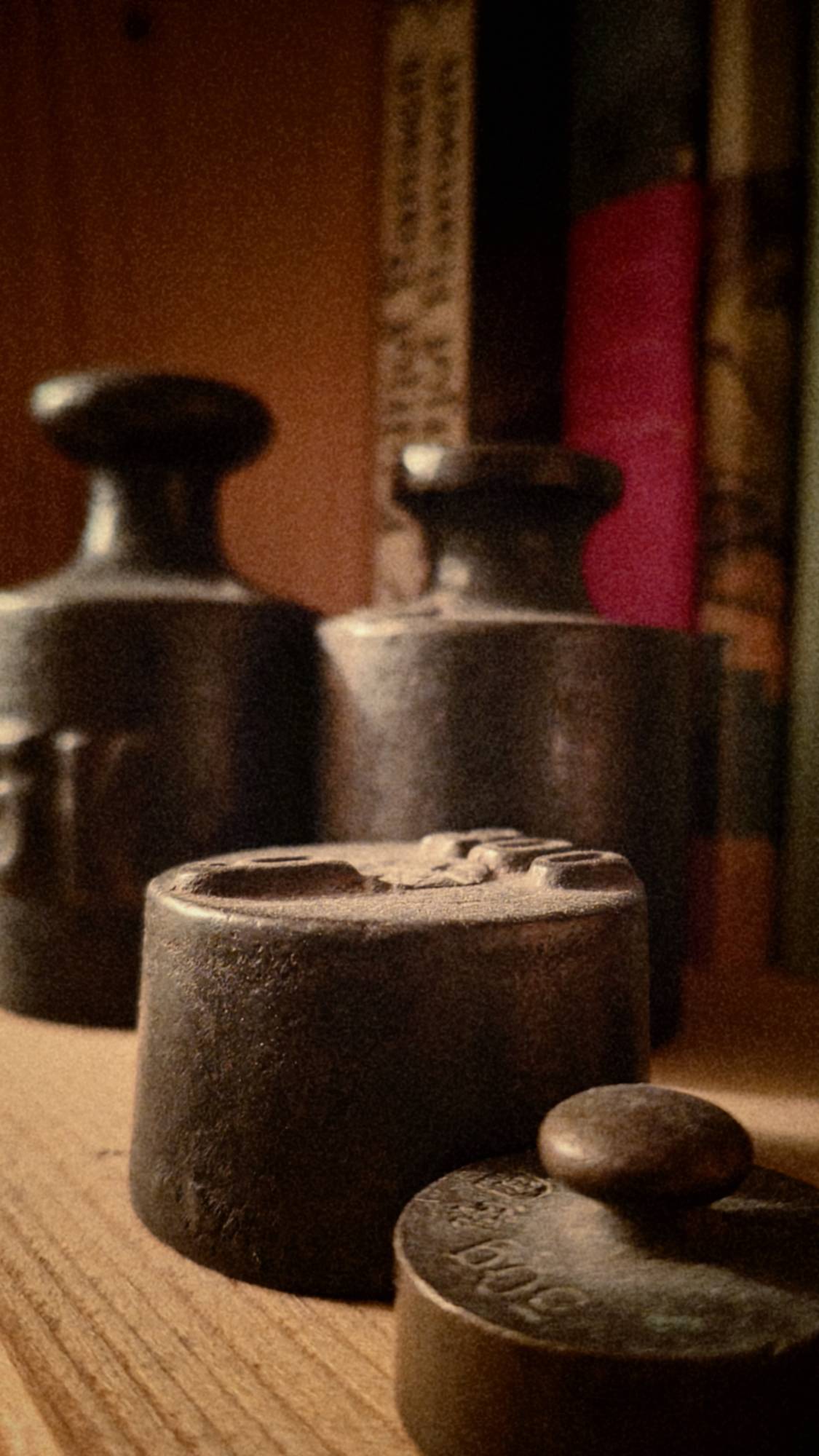 Old weights in a bookshelf. 